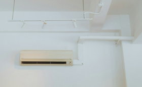 a air conditioner mounted to the ceiling of a room